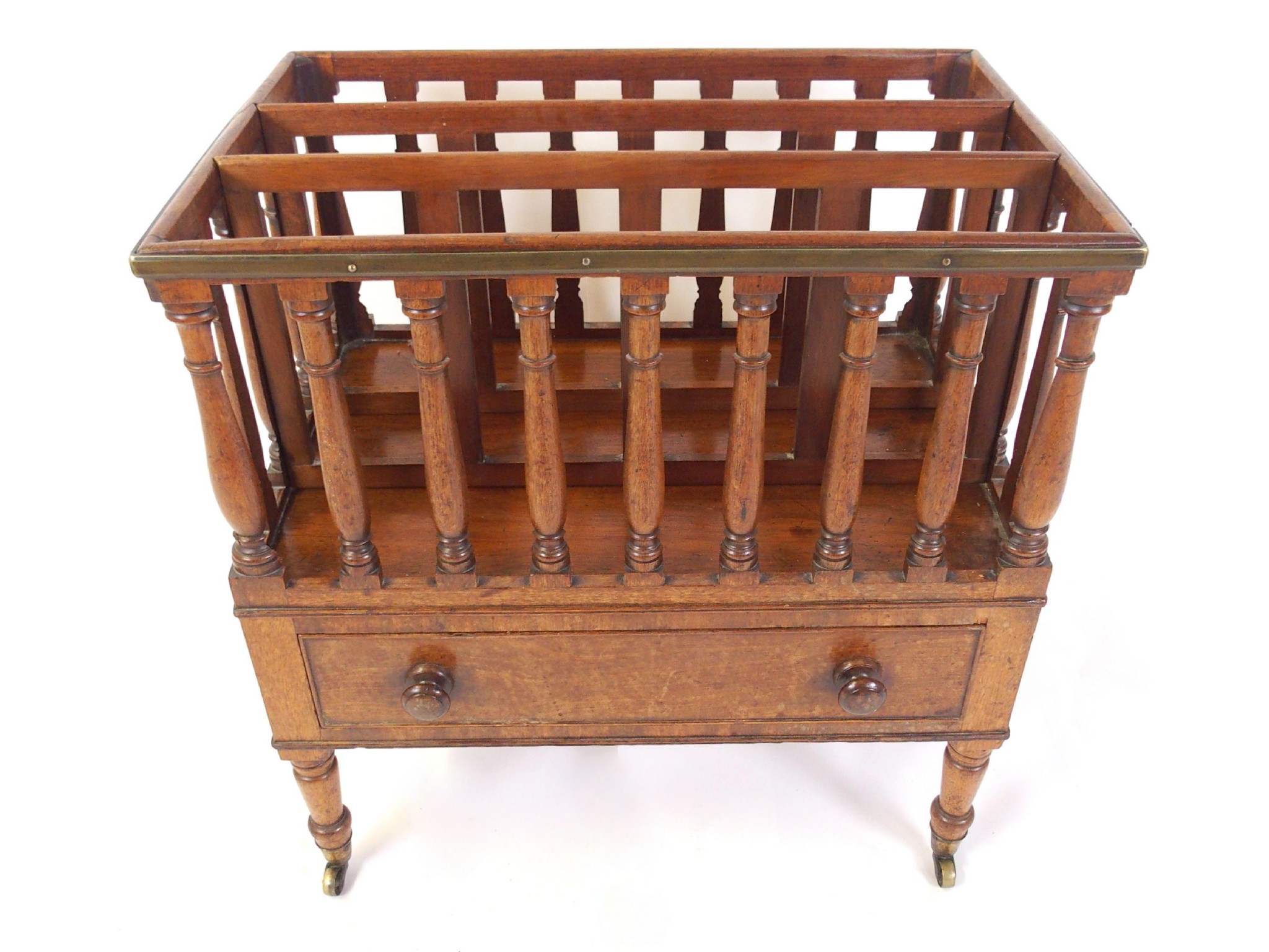 Appraisal: A mahogany canterbury with three divisions within half baluster turned