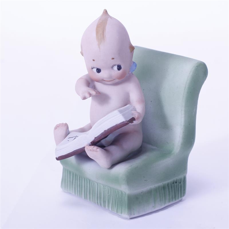 Appraisal: Rose O'Neill German Bisque Action Kewpie Doll Figure Seated in