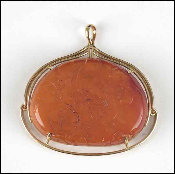 Appraisal: CARVED AMBER AND KARAT YELLOW GOLD PENDANT '' x ''