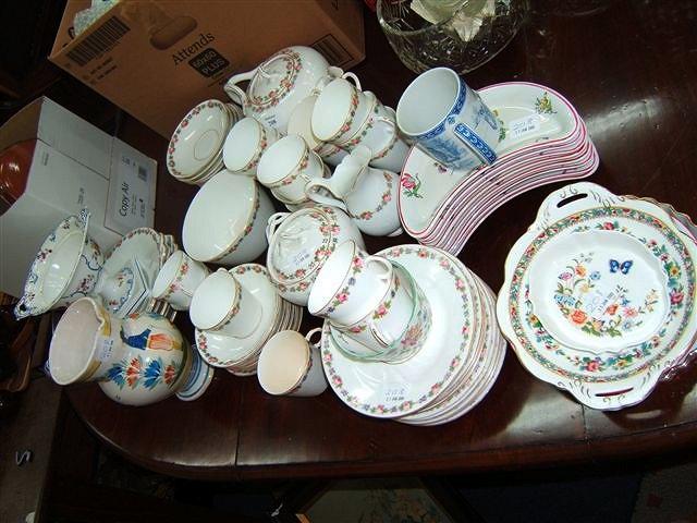 Appraisal: A porcelain tea service with hand painted floral designs together