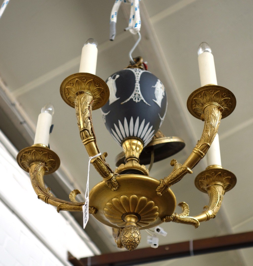 Appraisal: A gilt bronze four branch chandelier early th century the