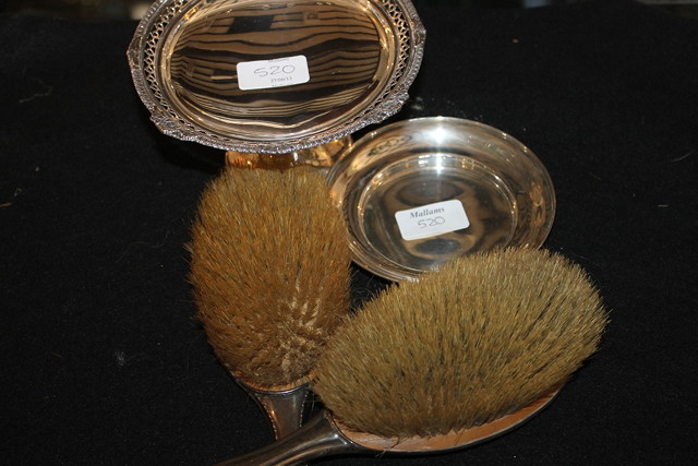 Appraisal: TWO SILVER BACKED HAIRBRUSHES with engraved decoration together with a