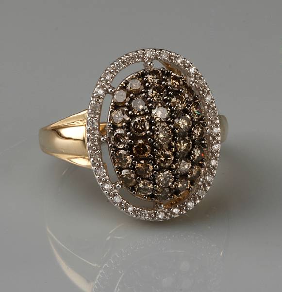 Appraisal: A colored diamond diamond and k bicolor gold ring estimated