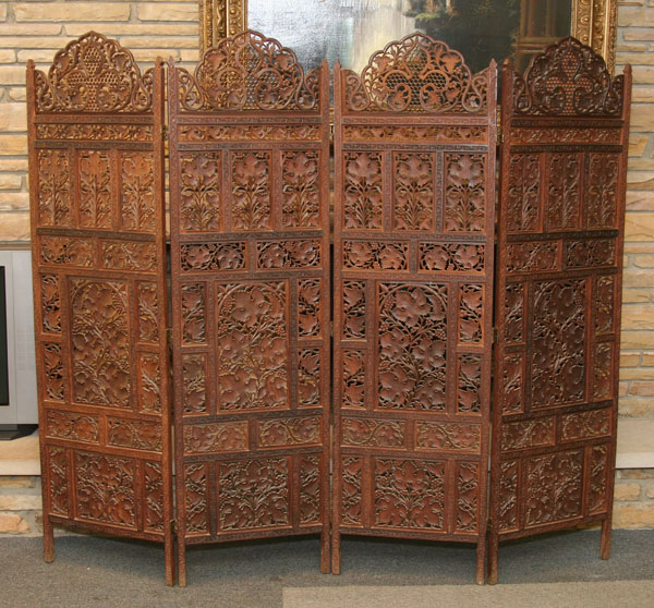 Appraisal: Four panel wooden screen ornate geometric and floral carving Middle