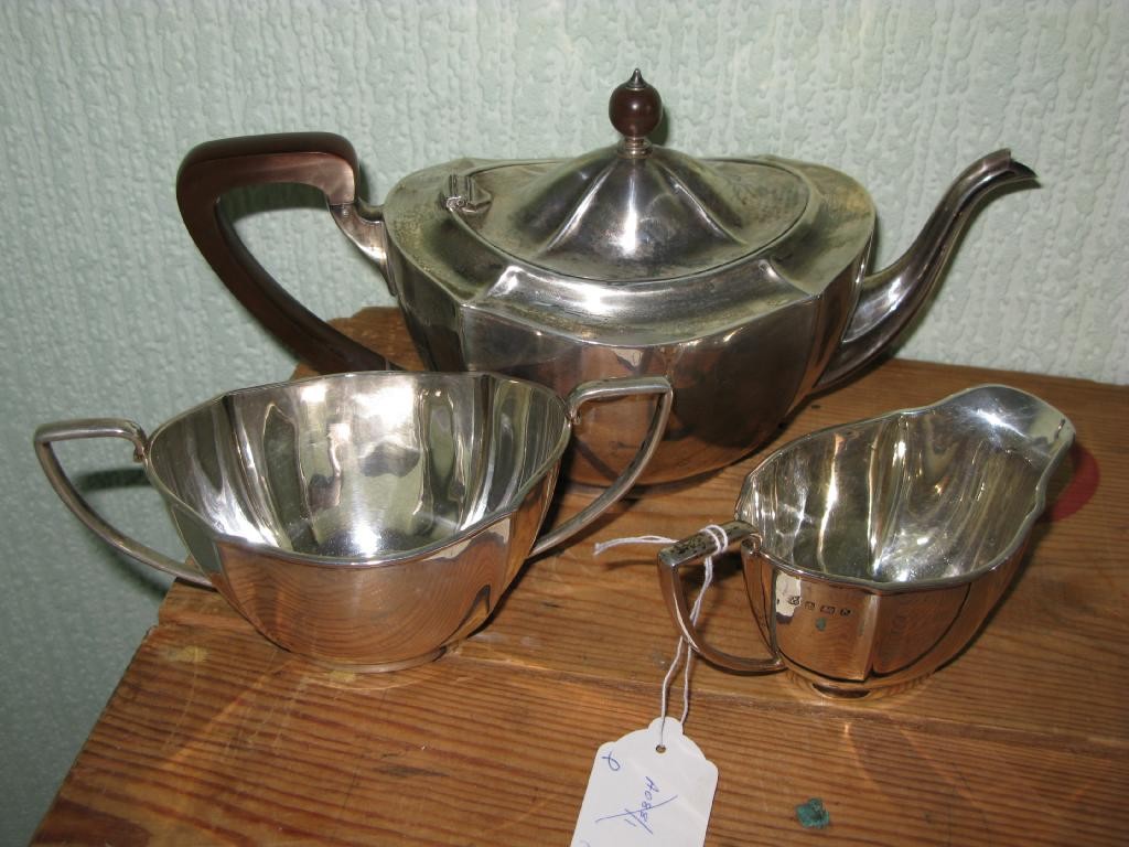 Appraisal: A silver three piece tea set teapot two handled sugar