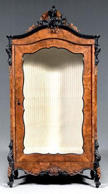 Appraisal: Rococo revival burlwood vitrine carved and parcel ebonized cartouche glazed