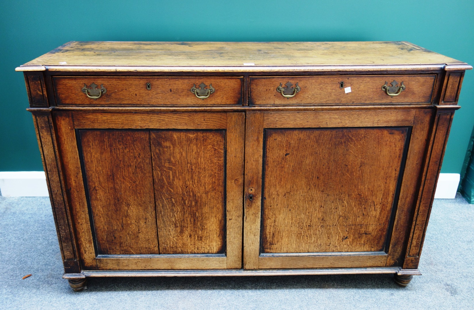 Appraisal: A George III oak dresser base with a pair of