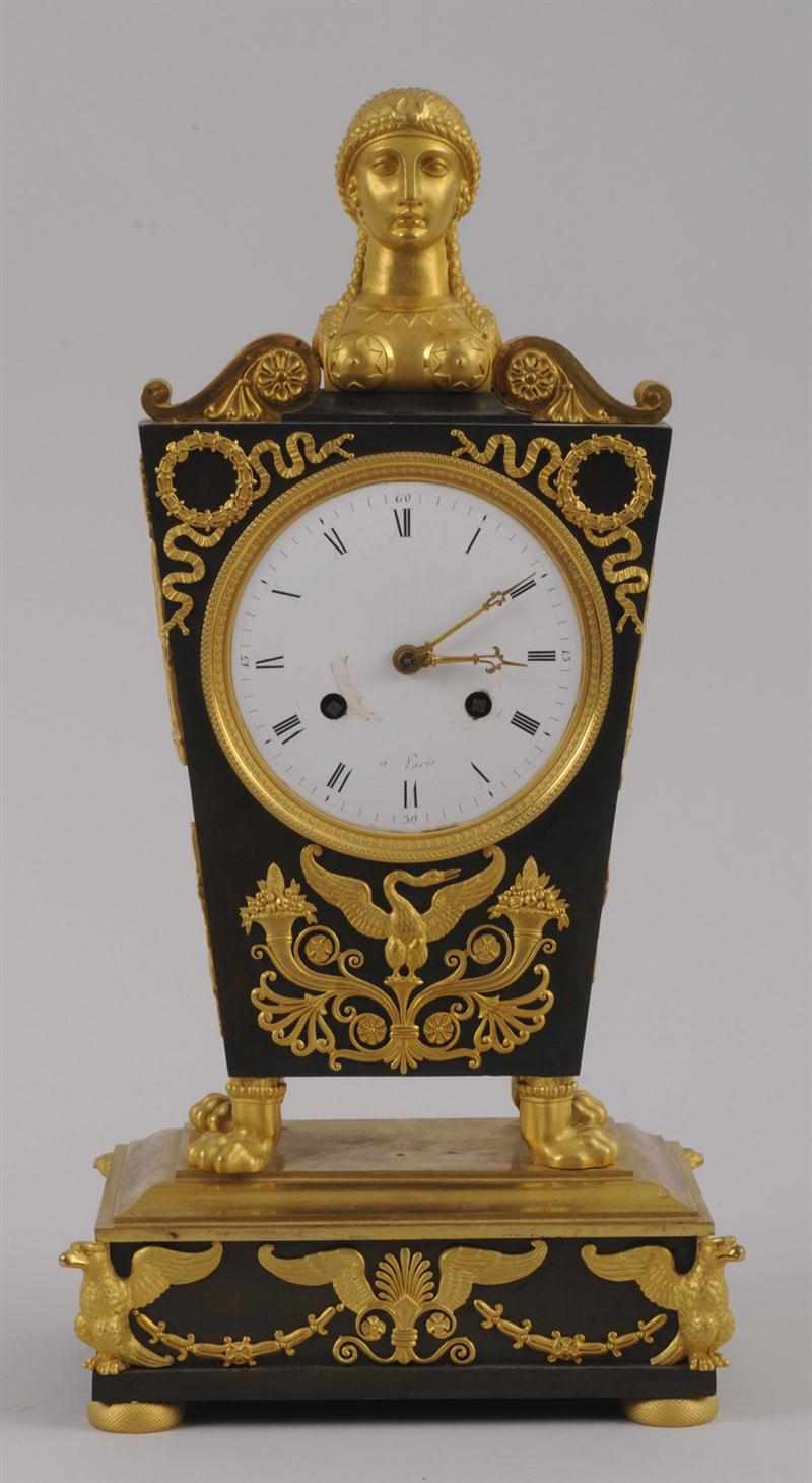 Appraisal: EMPIRE PATINATED AND GILT-BRONZE MANTEL CLOCK The in enamel dial