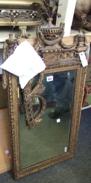 Appraisal: A th century continental gilt framed pier glass with urn