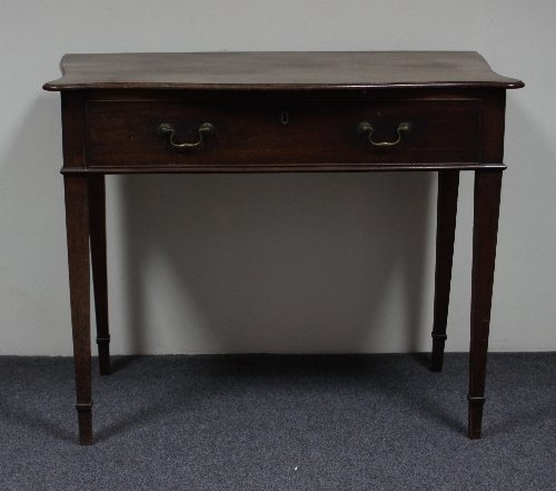 Appraisal: A George III mahogany serpentine topped side table with drawer