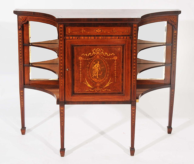 Appraisal: AN EDWARDIAN MAHOGANY SIDE CABINET shaped top over a central