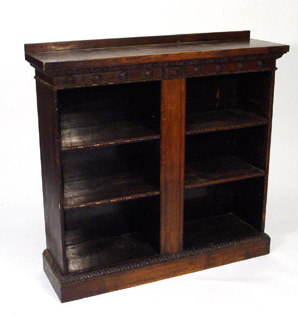 Appraisal: Edwardian oak bookcase with carved frieze above four adjustable shelves