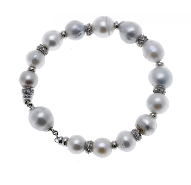 Appraisal: A BAROQUE PEARL AND DIAMOND BRACELET with alternate diamond spacers