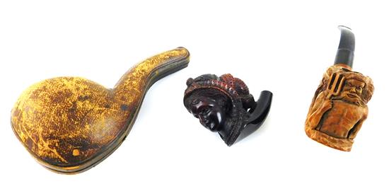 Appraisal: Two th th C elaborately carved pipes and pipe parts