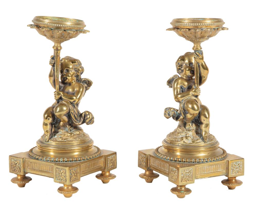 Appraisal: Pair of Napoleon III-Style Polished Bronze Figural Candlestands modeled in