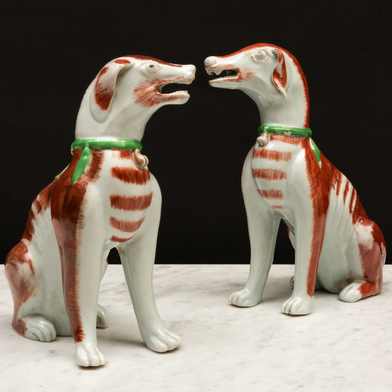 Appraisal: Pair of Porcelain Iron Red Decorated Models of Hounds Possibly