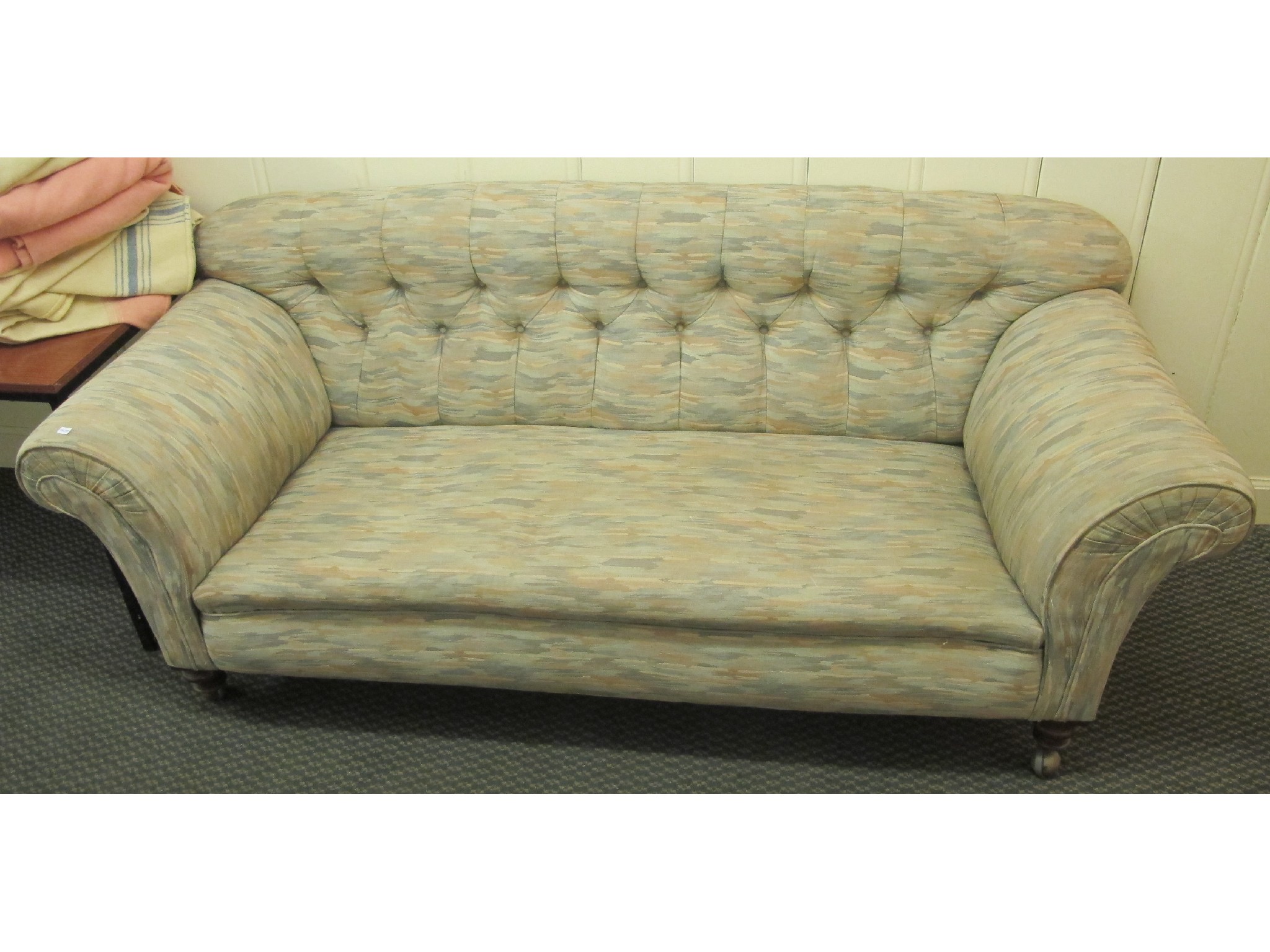 Appraisal: Button back upholstered three seater settee