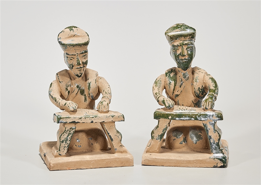 Appraisal: Two Chinese glazed pottery seated figures cleaning fish x x