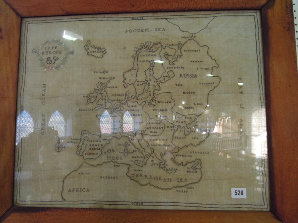 Appraisal: A needlepoint map of Europe dated hung within a maple