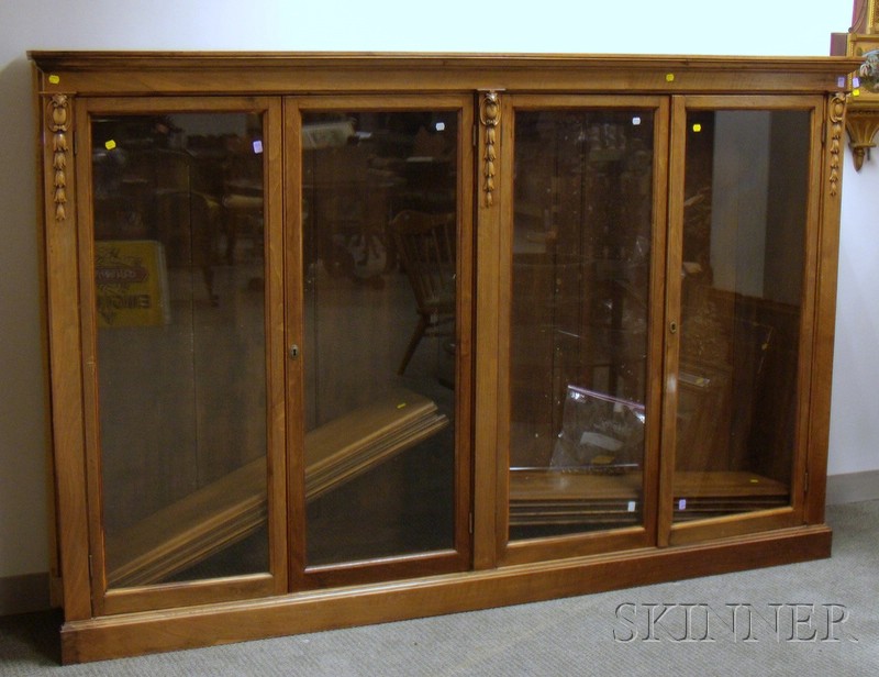 Appraisal: Georgian-style Carved Walnut and Walnut Veneer Four-Door Built-in Bookcase two