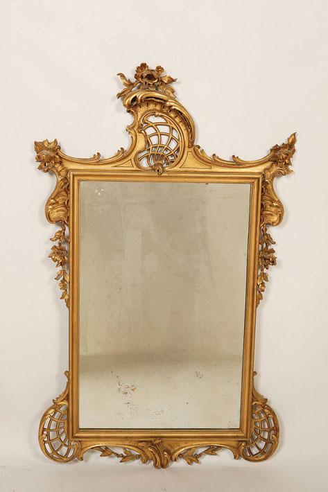 Appraisal: A GEORGE III STYLE WALL MIRROR of rococo design the