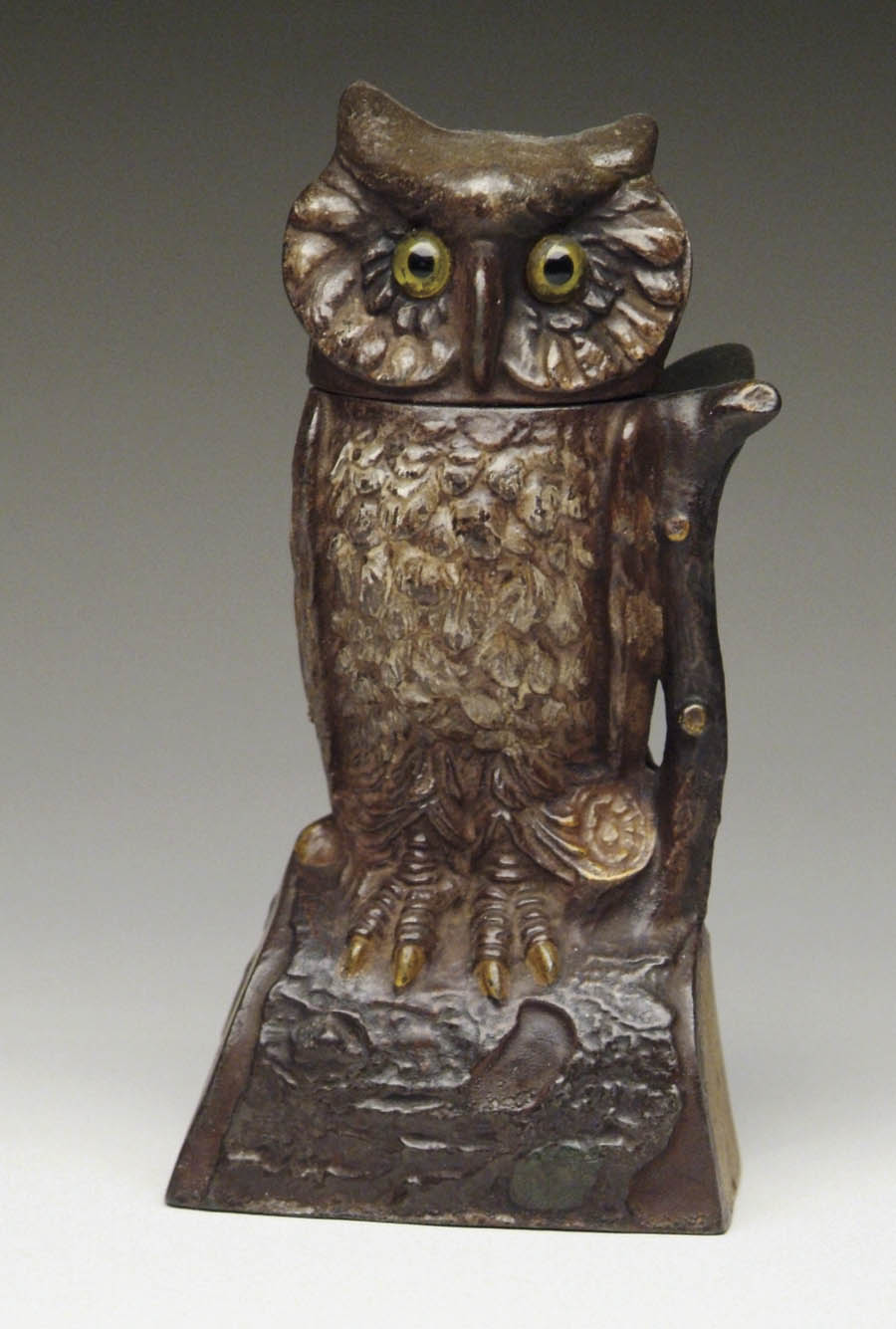 Appraisal: OWL TURNS HEAD MECHANICAL BANK Place penny on branch compress