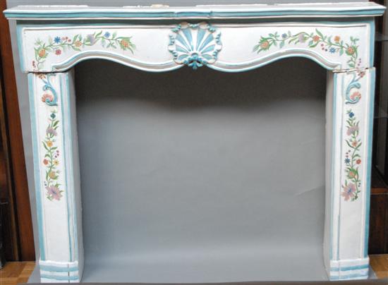 Appraisal: A TERRA COTTA FIREPLACE SURROUND With hand painted floral decoration