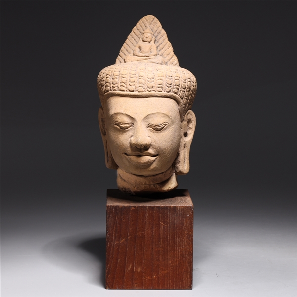 Appraisal: Antique possibly Khmer sandstone head with figure to top knot