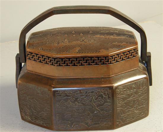 Appraisal: Chinese bronze octagonal hand warmer with twin loop handles the