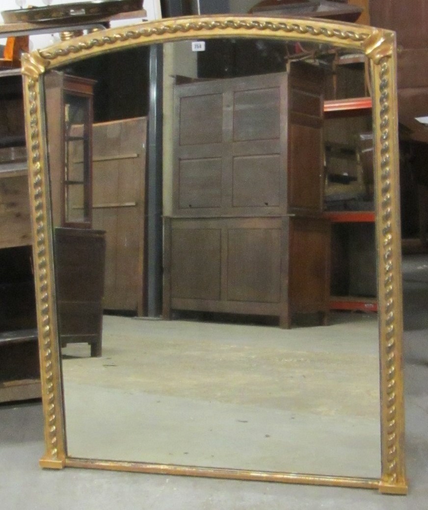 Appraisal: A th century gilt arch top overmantel wall mirror with