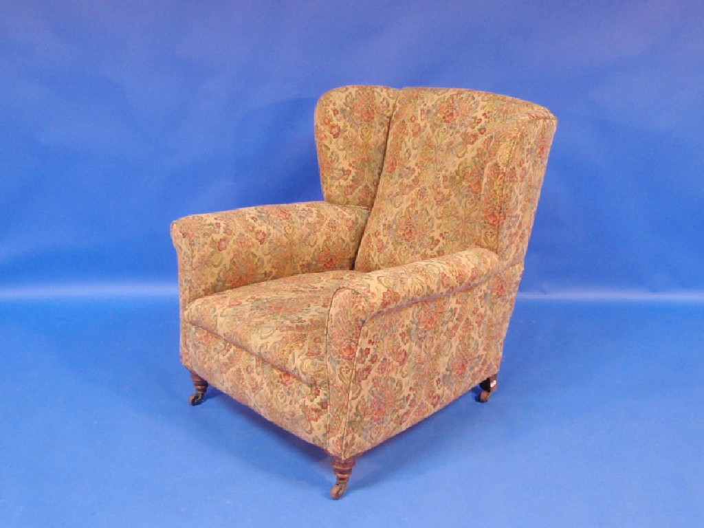 Appraisal: A late Victorian wing back armchair upholstered in floral tapestry