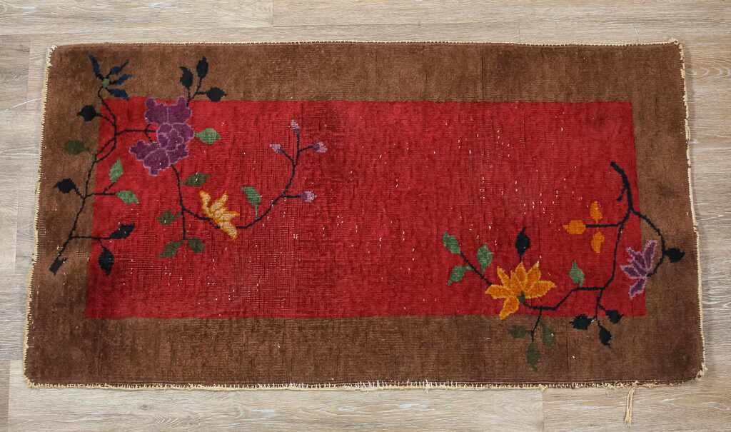 Appraisal: Art Deco Chinese rug Spotting and losses throughout burgundy field