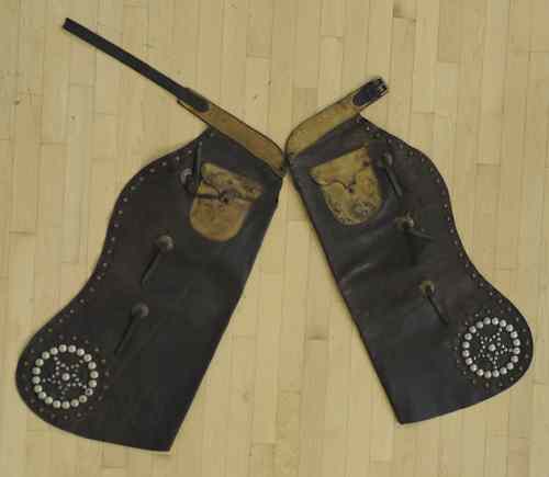 Appraisal: Pair of leather chaps early th c with button decoration