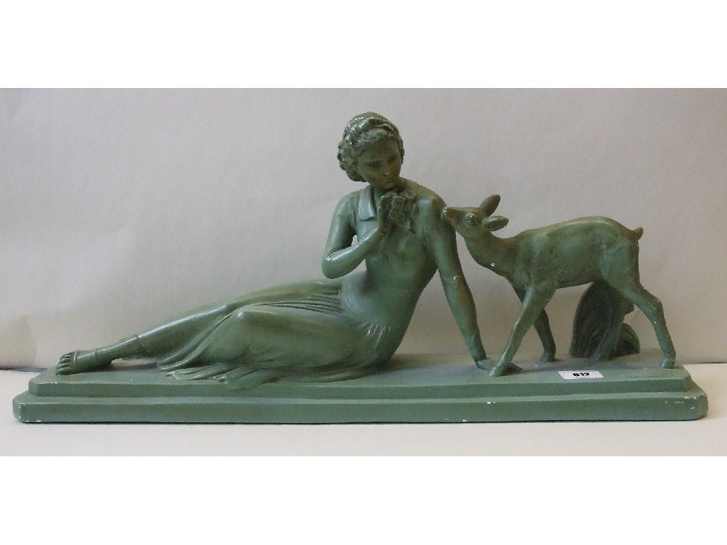 Appraisal: Art Deco green painted plaster figure of a girl and