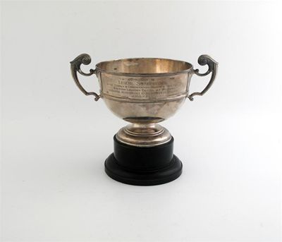 Appraisal: A small Edwardian two handled trophy cup inscribed and contained