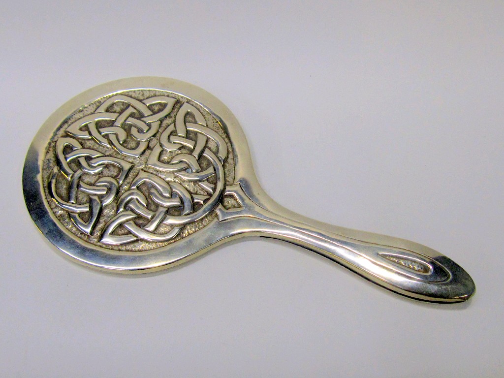 Appraisal: Iona white metal hand mirror with Celtic knotwork decoration