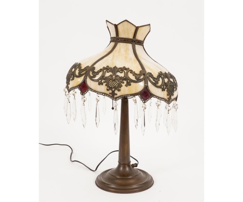 Appraisal: Ornate slag glass lamp with brass base circa numbered on