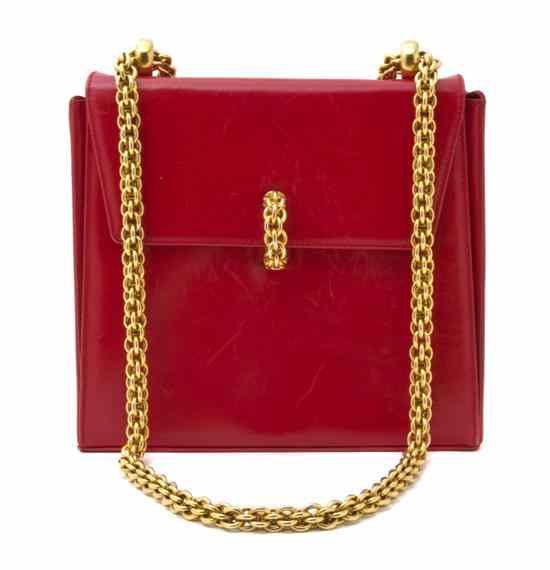 Appraisal: A Paloma Picasso Red Leather Bag trapezoidal shape with chainlink