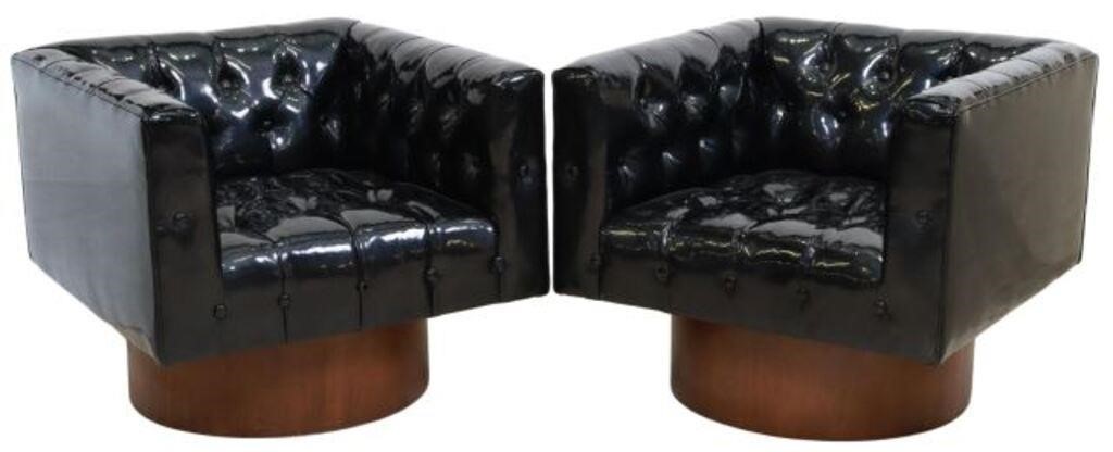 Appraisal: pair Black buttoned swivel tuxedo arm chairs st c rising