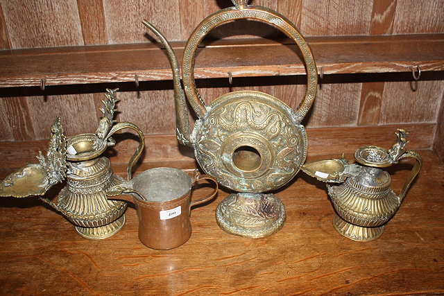 Appraisal: TWO INDIAN BRASS VESSELS a large ewer a copper jug