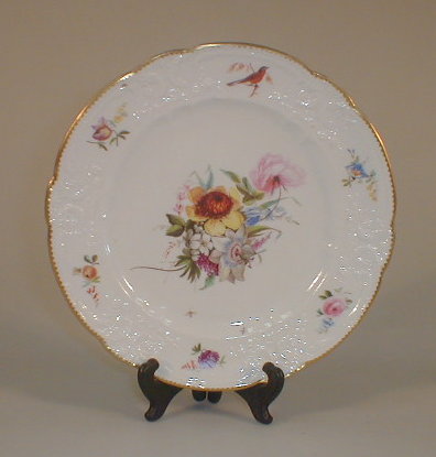 Appraisal: A Nantgarw plate centrally painted with a spray of summer