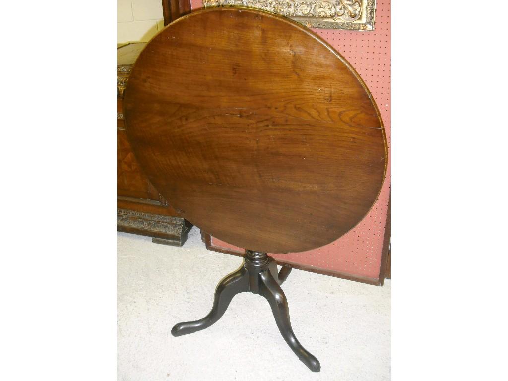 Appraisal: Georgian oak circular tilt-top tripod table upon a baluster turned