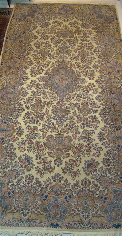 Appraisal: LARGE KIRMAN BLUE AND PINK FLORAL RUG Provenance ANTIQUE CONTEMPORARY