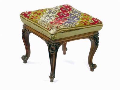 Appraisal: A Victorian carved walnut square stool with a needlework top