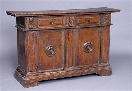 Appraisal: ITALIAN BAROQUE CARVED WALNUT CREDENZA The rectangular overhang top above