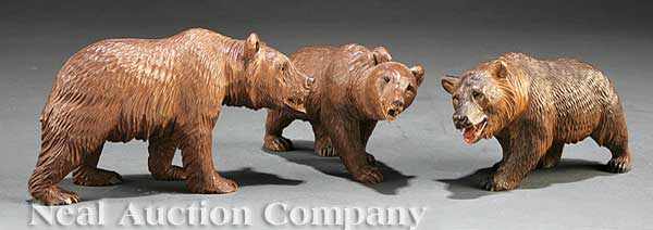 Appraisal: A Suite of Three Small Black Forest Carved Bears inset