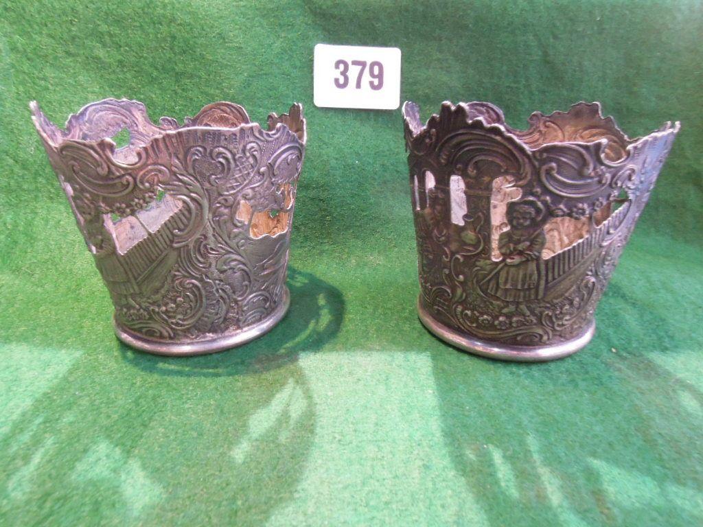 Appraisal: An engaging pair of imported silver glass covers depicting a