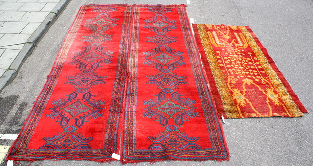 Appraisal: A PAIR OF TURKEY RED GROUND RUNNERS each decorated a