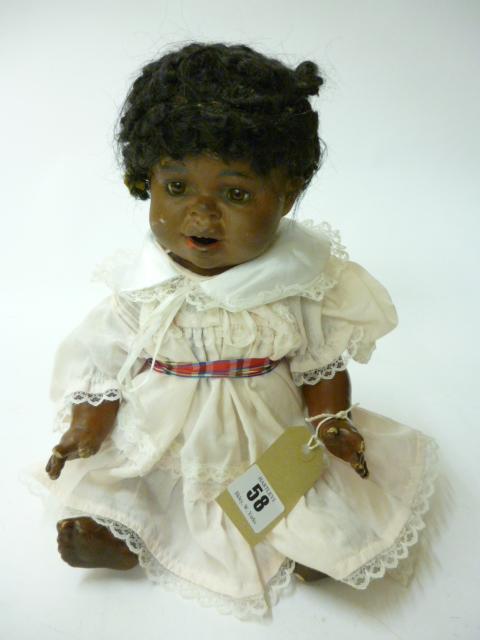 Appraisal: A Schutzmeister Quendt black bisque character doll fixed brown glass