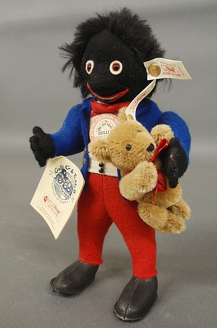 Appraisal: - Steiff Golly-G gollywog doll holding a small bear both